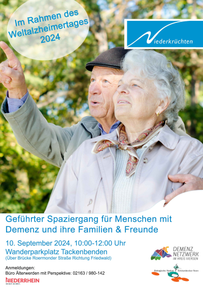 Ein älterer Mann und eine ältere Frau blicken nach oben links. Er zeigt auf etwas, das auf dem Bildausschnitt nicht zu sehen ist.